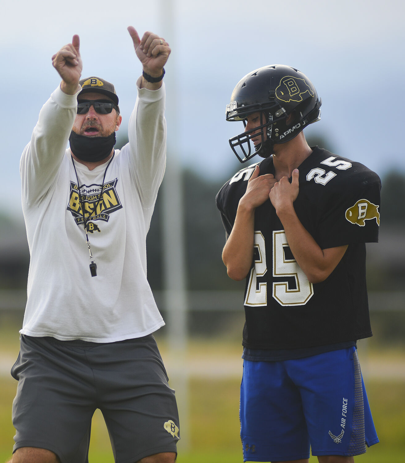 Buffalo head coach Rob Hammond explains a team drill to the players